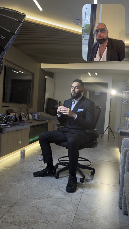 Dr Adeel Ali practising his delivery on set, with Scott Alexander visible in the recording
