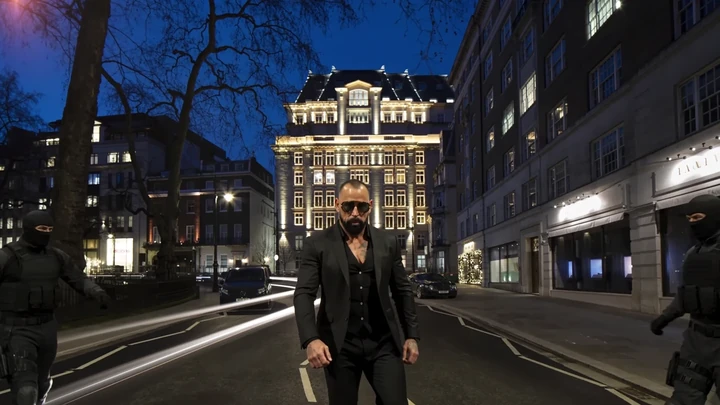 Scott Alexander in a suit in his Mayfair action film
